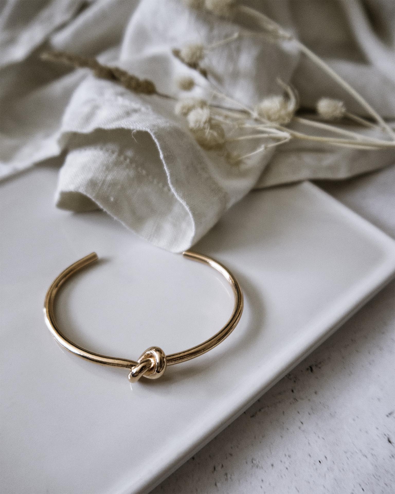 Gold knot bangle deals bracelet